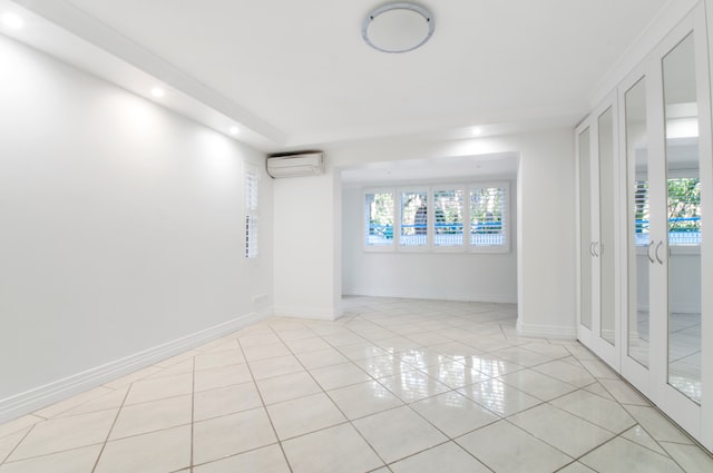 Empty room of a house with lights turned on